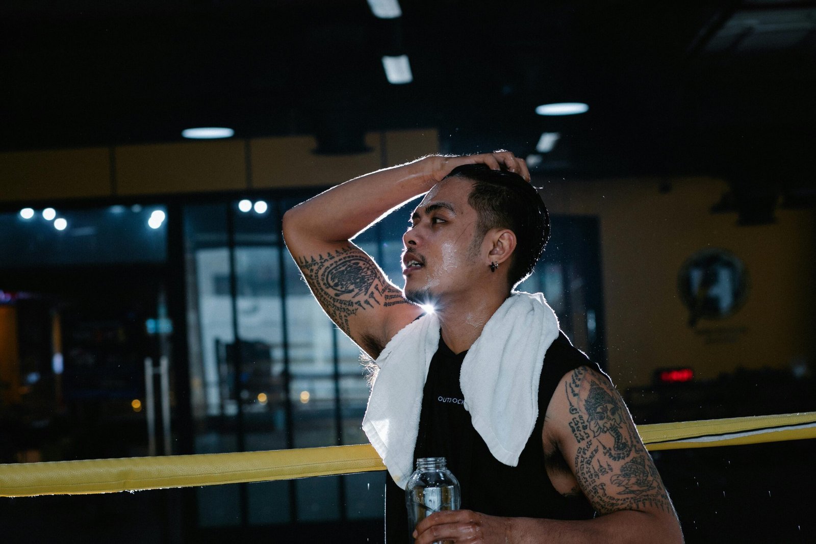 Man feeling exhausted at the gym despite trying various products